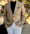 Load image into Gallery viewer, Man wearing a brown blazer over a black shirt with white pants outdoors.
